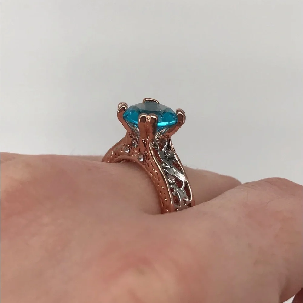 Mixed Metal Solitaire Ring with Blue Stone